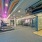 West Sacramento, CA Luxury Apartments | The Bernice | Fitness Center with Cardio Equipment, Free Weights, Strength Training Machines, Mirror Wall, and Floor-to-Ceiling Windows.