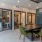 spacious lounge room with ample seating and modern colors and decor with bright-natural lighting