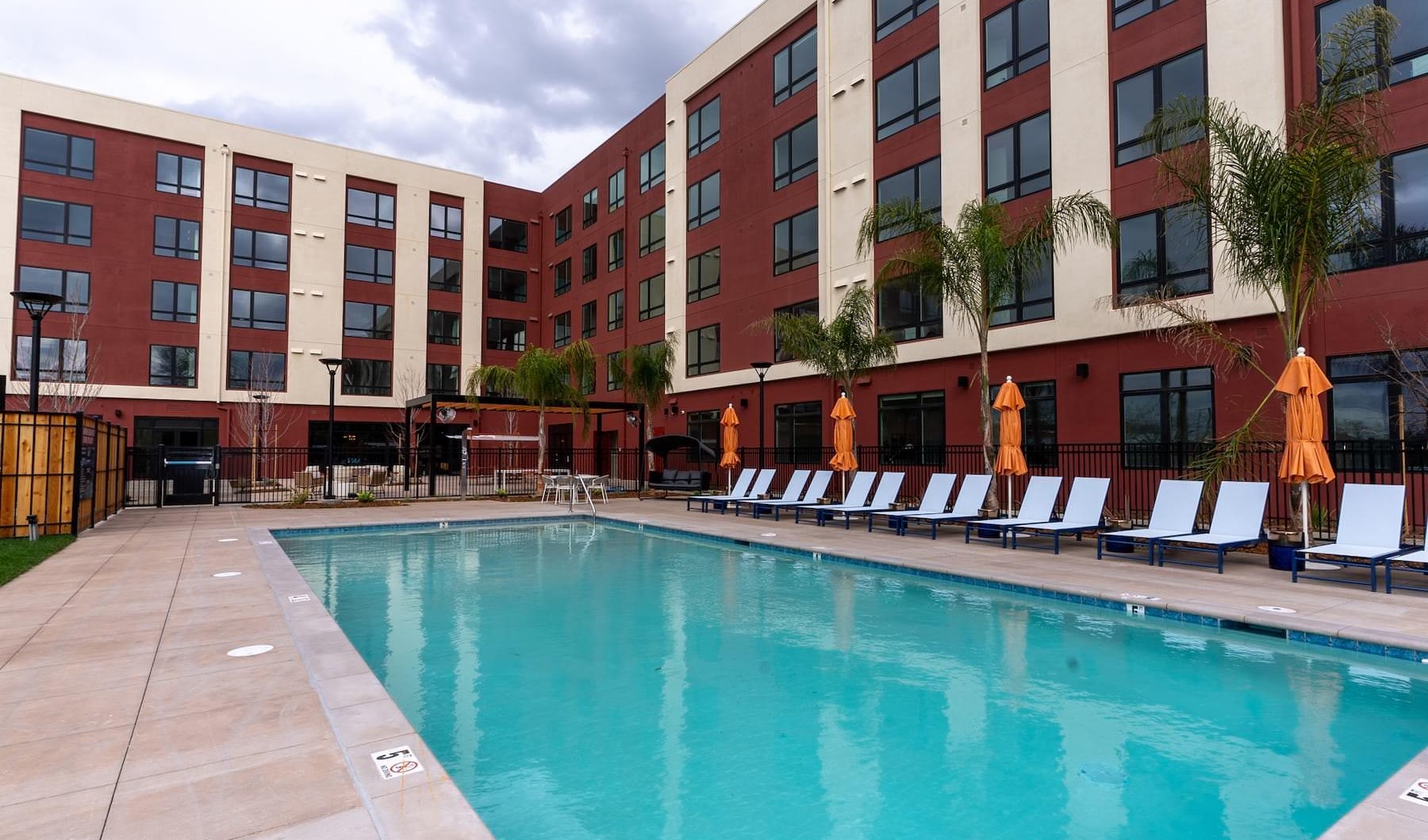 Perfect Blend of Sophistication and Comfort a swimming pool outside a building