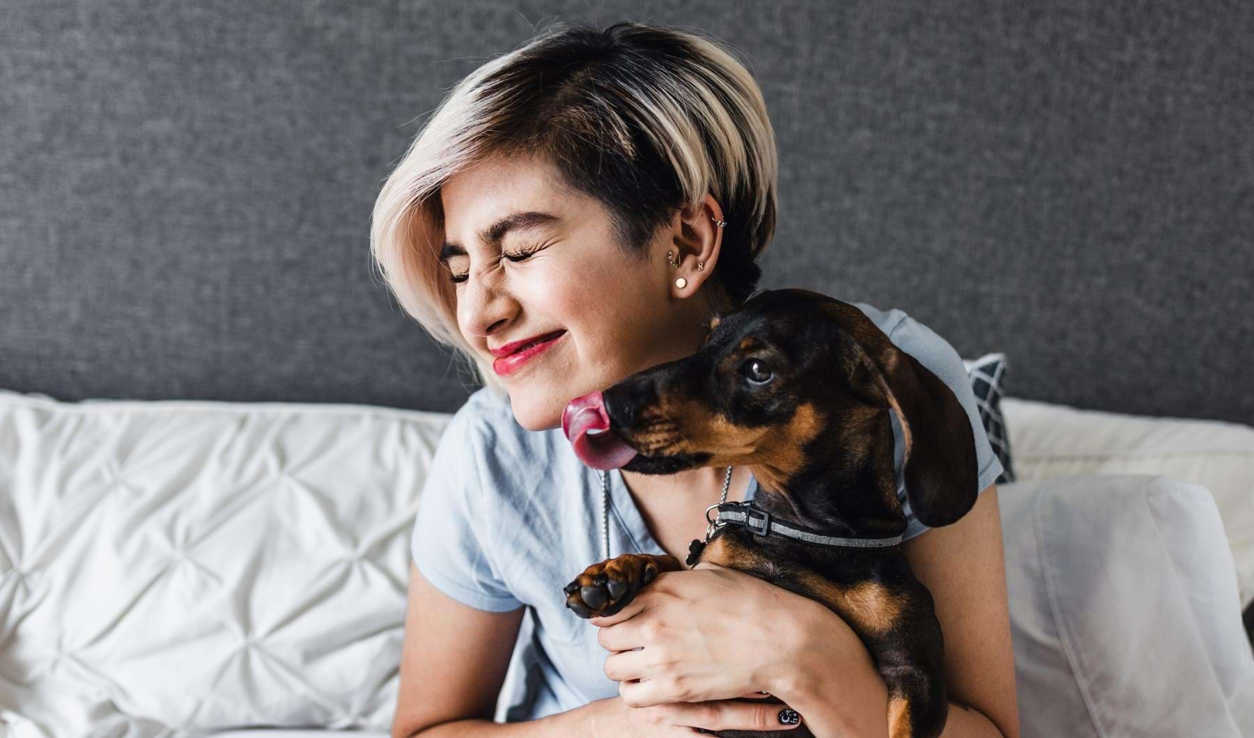 The Bernice is a pet-friendly community! a person holding a dog